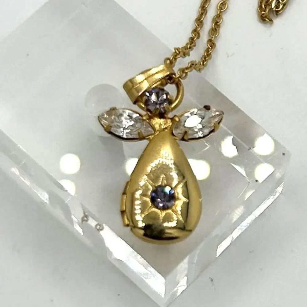 Vintage gold tone angel pendant locket birthstone necklace - purple rhinestone